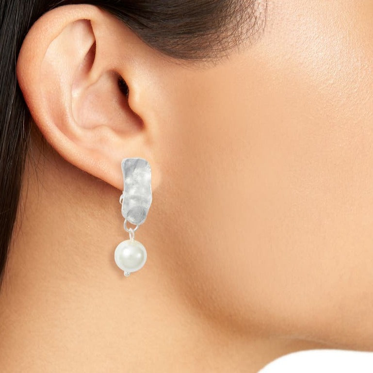 Silver Cobblestone Pearl Clip-On Earring worn close up showing irregular metal and white pearl