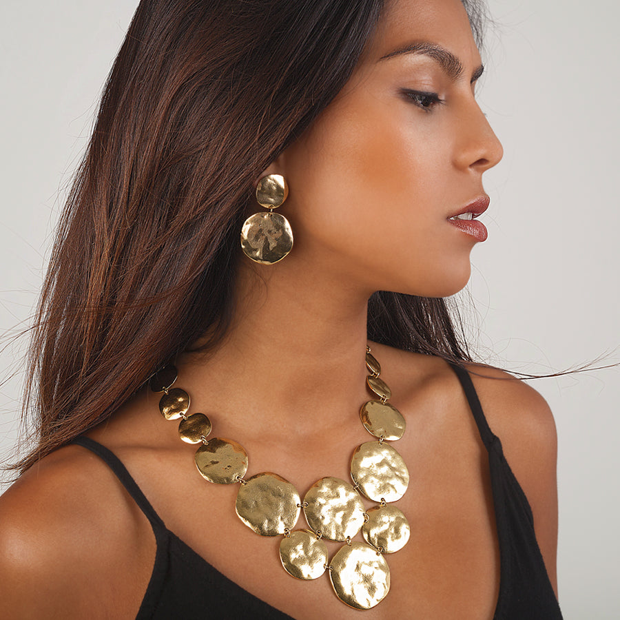 Gold Double Disc Drop Earrings worn on brunette model with matching hammered disc necklace