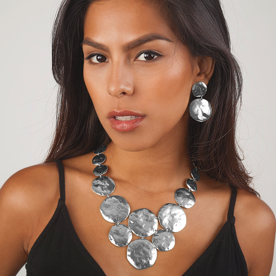 Silver Double Disc Drop Earrings worn on brunette model with matching textured disc necklace