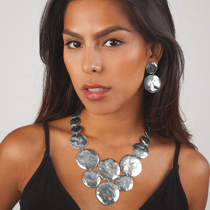 Silver Double Disc Drop Earrings worn on brunette model with matching textured disc necklace