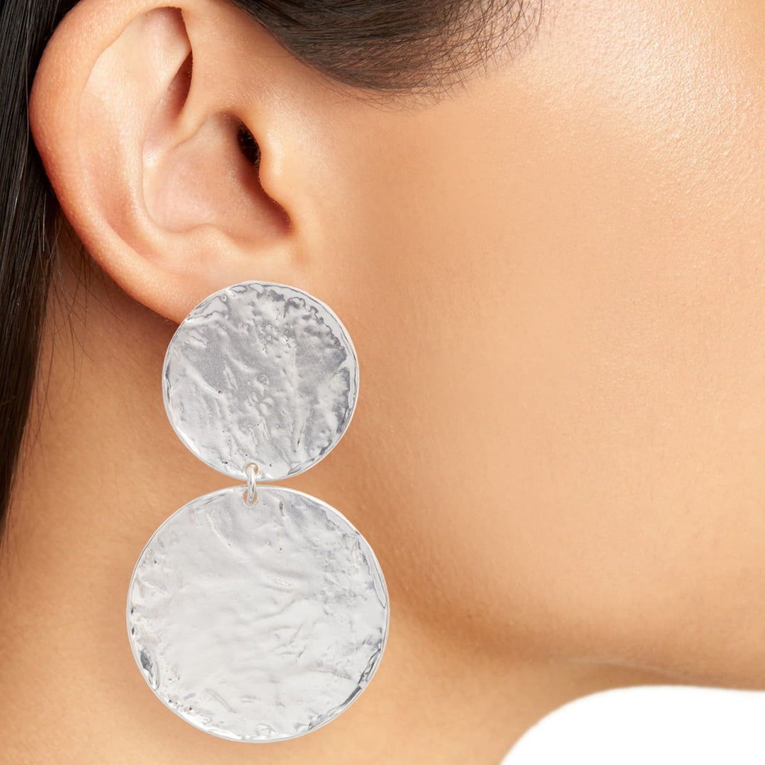 Silver Hammered Discs Clip-On Earring worn close up showing textured dangling discs